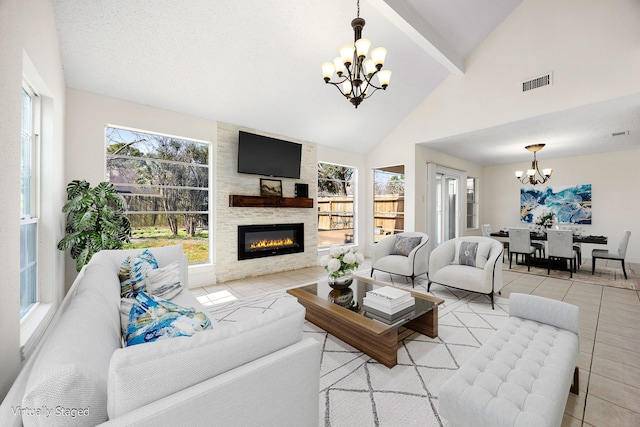 living area featuring a notable chandelier, visible vents, a large fireplace, tile patterned flooring, and beamed ceiling