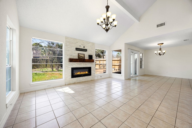 unfurnished living room featuring a chandelier, light tile patterned floors, a fireplace, visible vents, and beamed ceiling