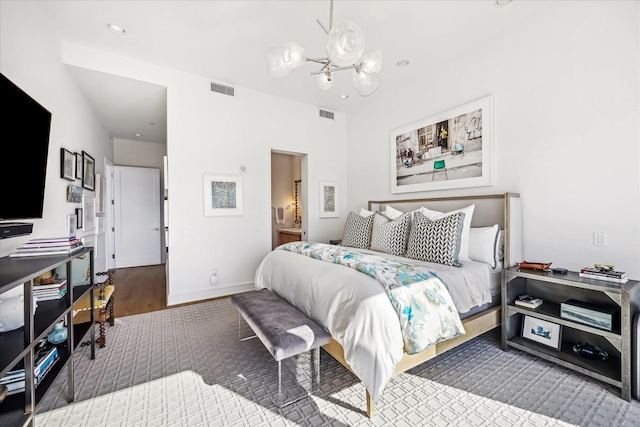 bedroom featuring baseboards, visible vents, a notable chandelier, and recessed lighting