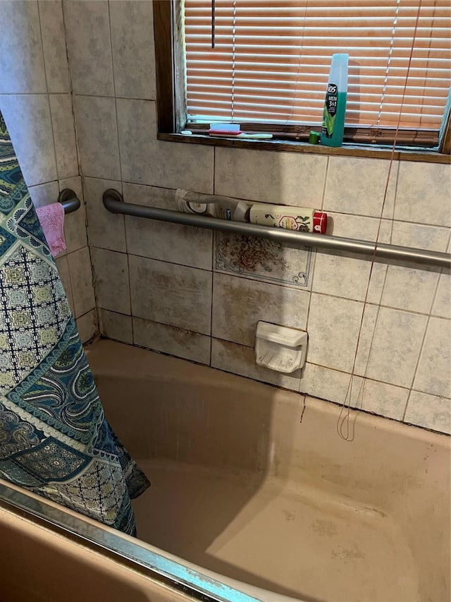 full bathroom with a tub to relax in