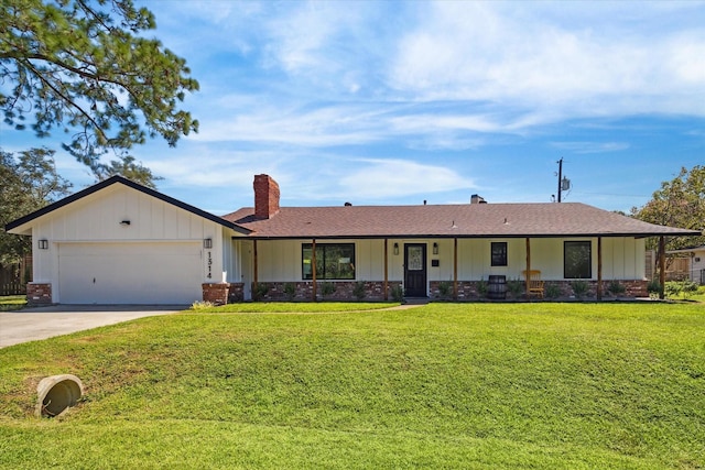 ranch-style house featuring a garage, brick siding, concrete driveway, a chimney, and a front yard