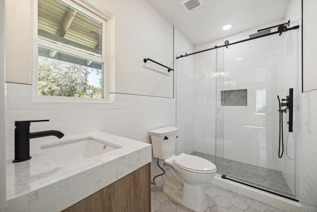 bathroom with toilet, a shower stall, visible vents, and tile patterned floors