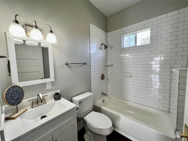 full bathroom featuring a textured wall, shower / bathing tub combination, vanity, and toilet