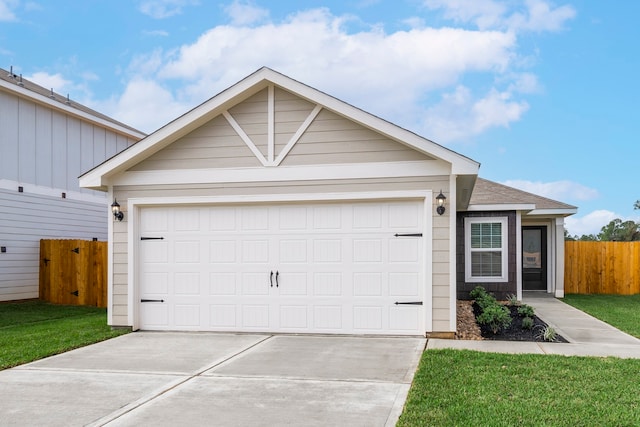 ranch-style home featuring a garage, concrete driveway, a front yard, and fence