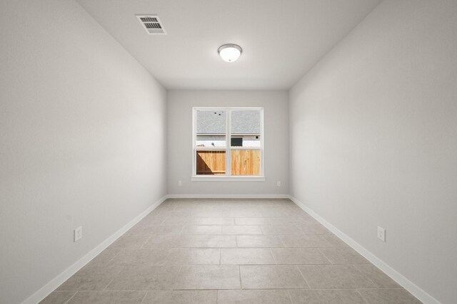 289 Galant Fox Way, New Caney, TX 77357 - spare room featuring light tile patterned floors, visible vents, and baseboards