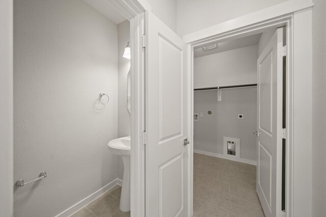 289 Galant Fox Way, New Caney, TX 77357 - bathroom with baseboards and tile patterned floors