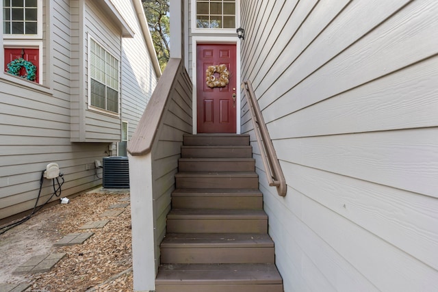 doorway to property featuring central AC unit