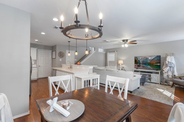 dining space with dark wood-type flooring, recessed lighting, visible vents, and ceiling fan