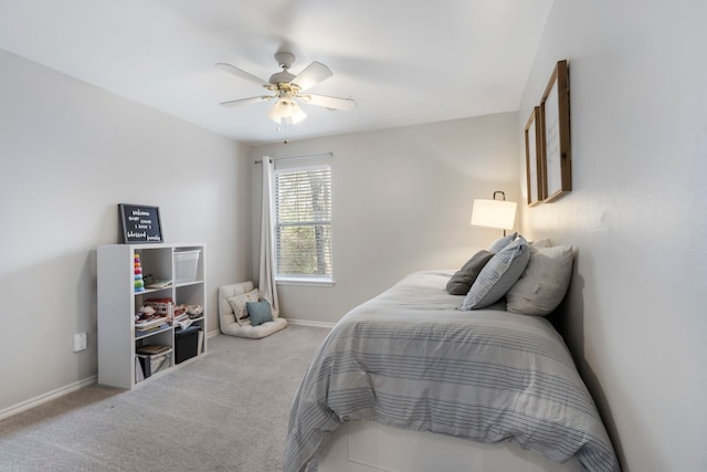 bedroom with ceiling fan, carpet, and baseboards