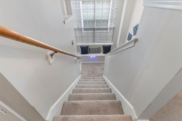 stairs with carpet flooring and baseboards