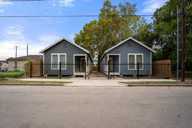 bungalow-style house with a fenced front yard