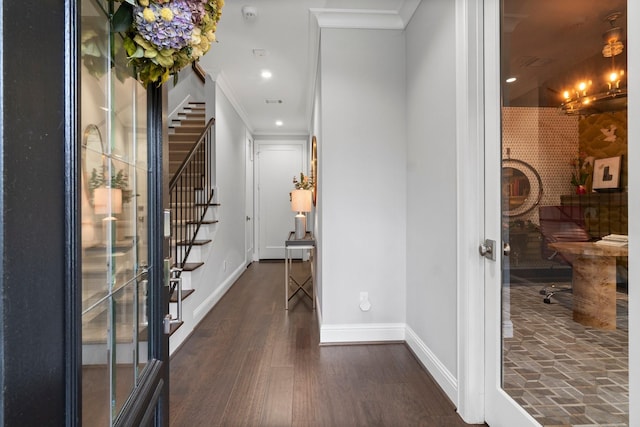 interior space featuring recessed lighting, dark wood-type flooring, baseboards, stairway, and crown molding