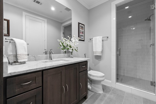 full bathroom featuring a stall shower, visible vents, toilet, crown molding, and vanity