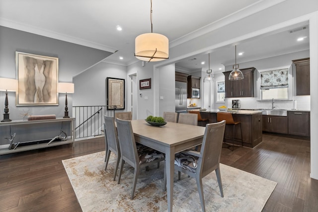 dining area featuring dark wood-style floors, crown molding, visible vents, and recessed lighting