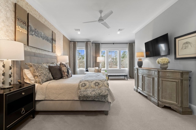 bedroom with carpet floors, ceiling fan, and visible vents