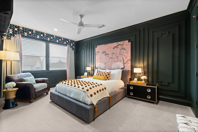 bedroom featuring light carpet, ceiling fan, and visible vents