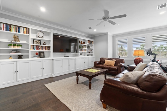 living room with ceiling fan, visible vents, dark wood finished floors, and crown molding