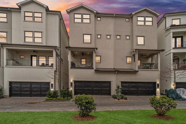 exterior space featuring a garage and decorative driveway