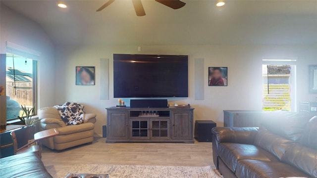 living area featuring light wood-style floors, recessed lighting, vaulted ceiling, and ceiling fan