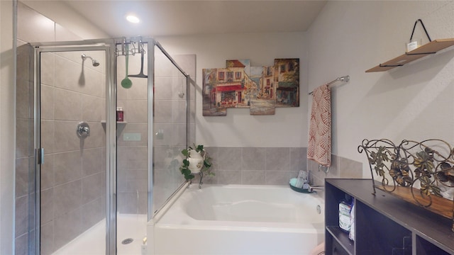 full bath featuring a shower stall and a bath