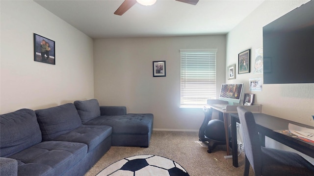 office area with carpet floors, ceiling fan, and baseboards