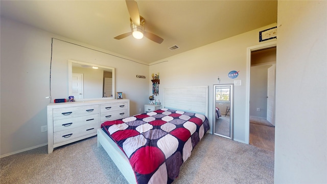 carpeted bedroom featuring visible vents, ceiling fan, and baseboards