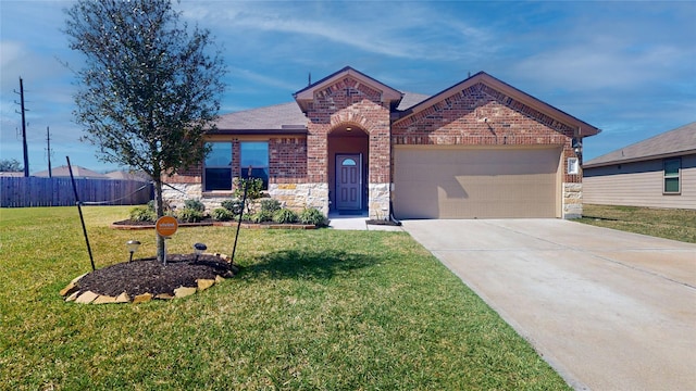 view of front of house featuring stone siding, an attached garage, fence, brick siding, and driveway