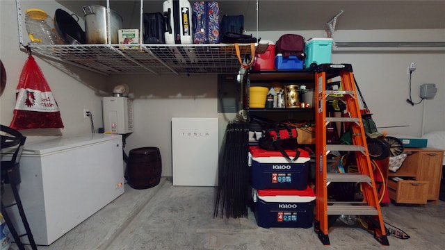 interior space featuring refrigerator, tankless water heater, and white fridge