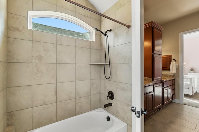 full bathroom featuring wood finished floors and bathing tub / shower combination