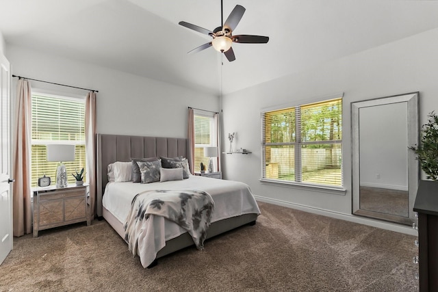 carpeted bedroom featuring ceiling fan and baseboards