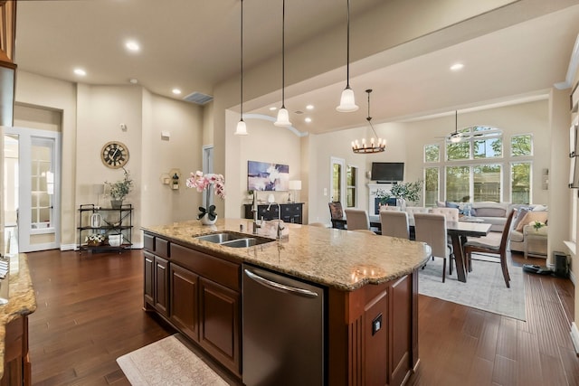 kitchen with open floor plan, stainless steel dishwasher, dark wood-type flooring, and a sink