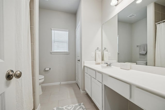 full bath with visible vents, toilet, vanity, baseboards, and tile patterned floors