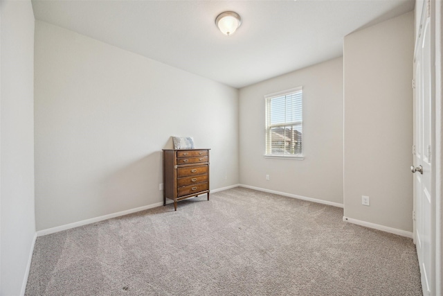 unfurnished bedroom with carpet and baseboards