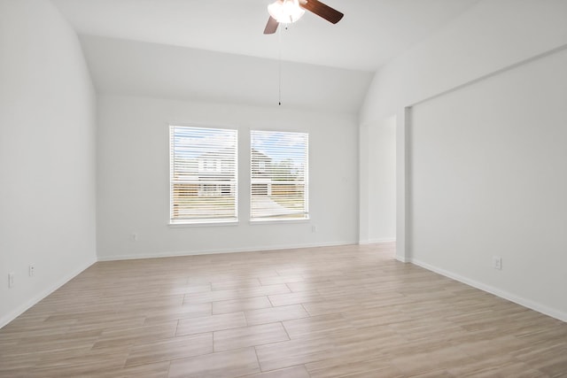 18532 Burch Creek Ln, Magnolia, TX 77355 - unfurnished room with vaulted ceiling, a ceiling fan, light wood-style flooring, and baseboards