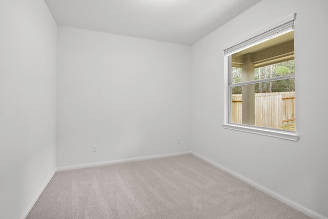 18532 Burch Creek Ln, Magnolia, TX 77355 - empty room featuring carpet flooring and baseboards