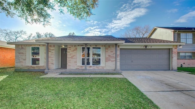 ranch-style house featuring concrete driveway, brick siding, an attached garage, and a front yard