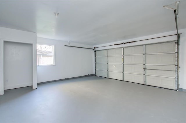 garage featuring baseboards