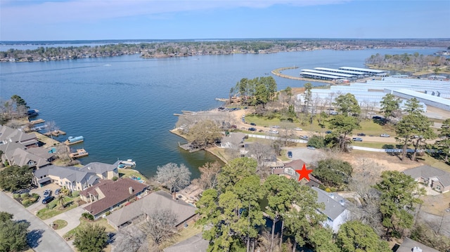 bird's eye view featuring a water view and a residential view