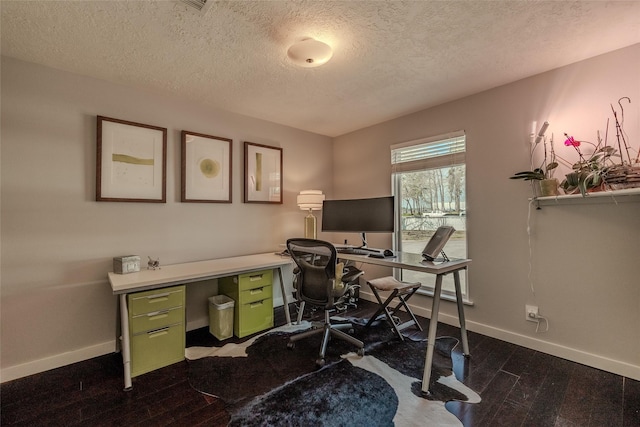 office area featuring dark wood-style floors, a textured ceiling, and baseboards