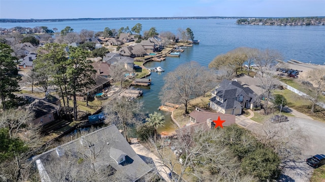 birds eye view of property featuring a residential view and a water view