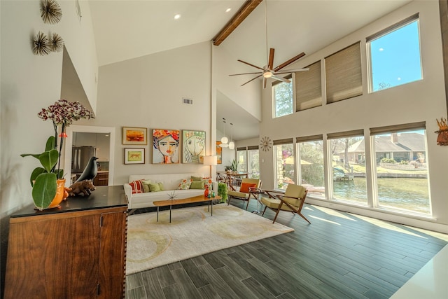 living room with vaulted ceiling with beams, ceiling fan, recessed lighting, dark wood-style flooring, and visible vents