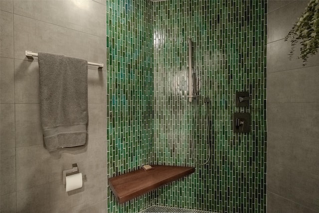 bathroom with a tile shower