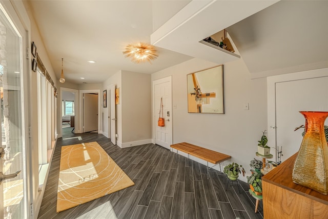 interior space with wood finish floors, baseboards, and recessed lighting