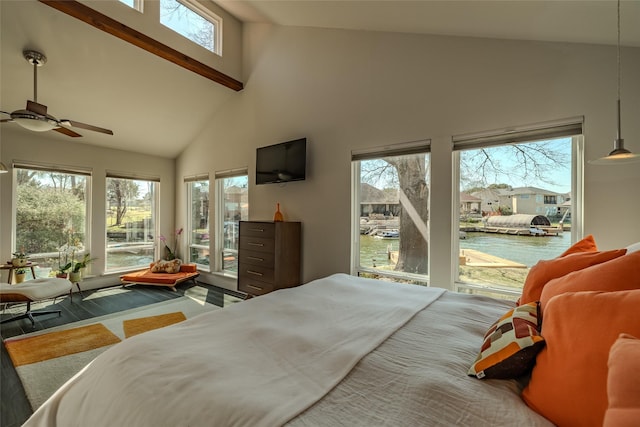 bedroom with access to exterior and high vaulted ceiling