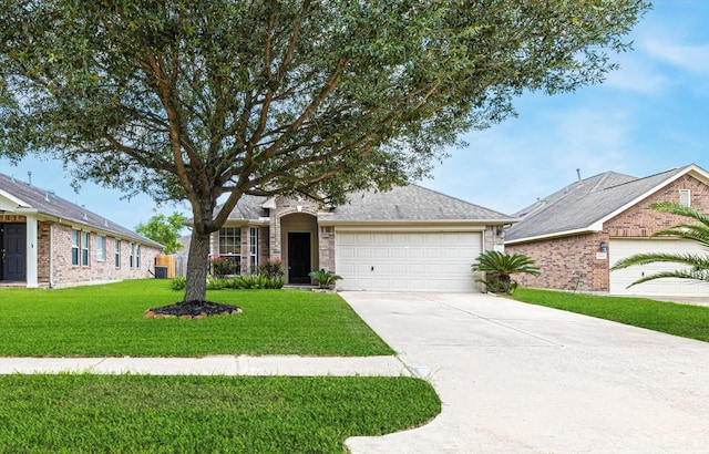 ranch-style home featuring a garage, a front yard, roof with shingles, and driveway