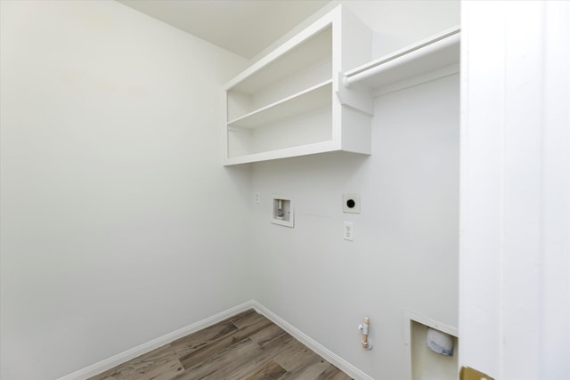 laundry room featuring hookup for a washing machine, gas dryer hookup, electric dryer hookup, laundry area, and baseboards