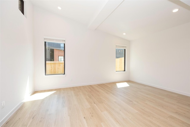 spare room with light wood-type flooring, lofted ceiling with beams, baseboards, and recessed lighting