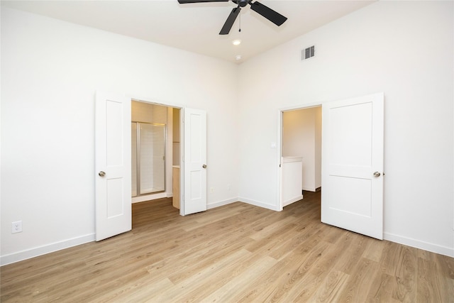 unfurnished bedroom with ceiling fan, light wood-type flooring, visible vents, and baseboards