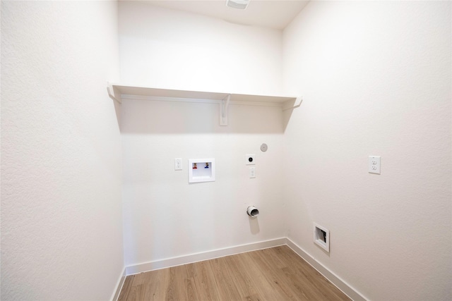 washroom featuring laundry area, washer hookup, baseboards, light wood finished floors, and electric dryer hookup