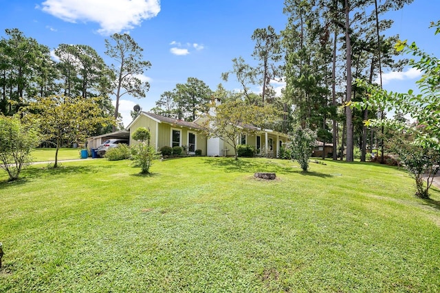 view of yard featuring an attached carport